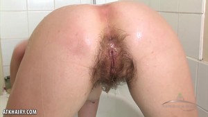 Getting a hairy pussy wet in the bath tub